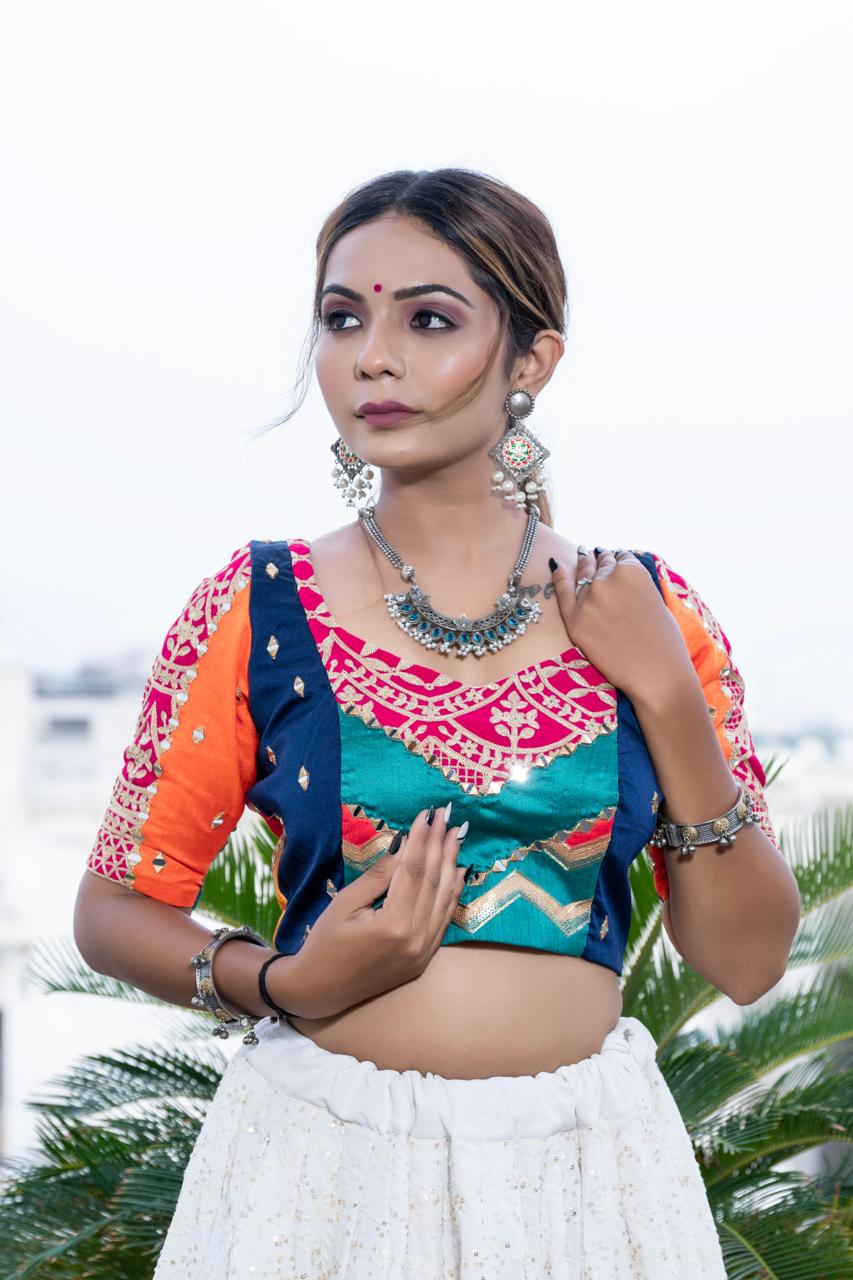 White Choli with Blue Multicolor blouse.