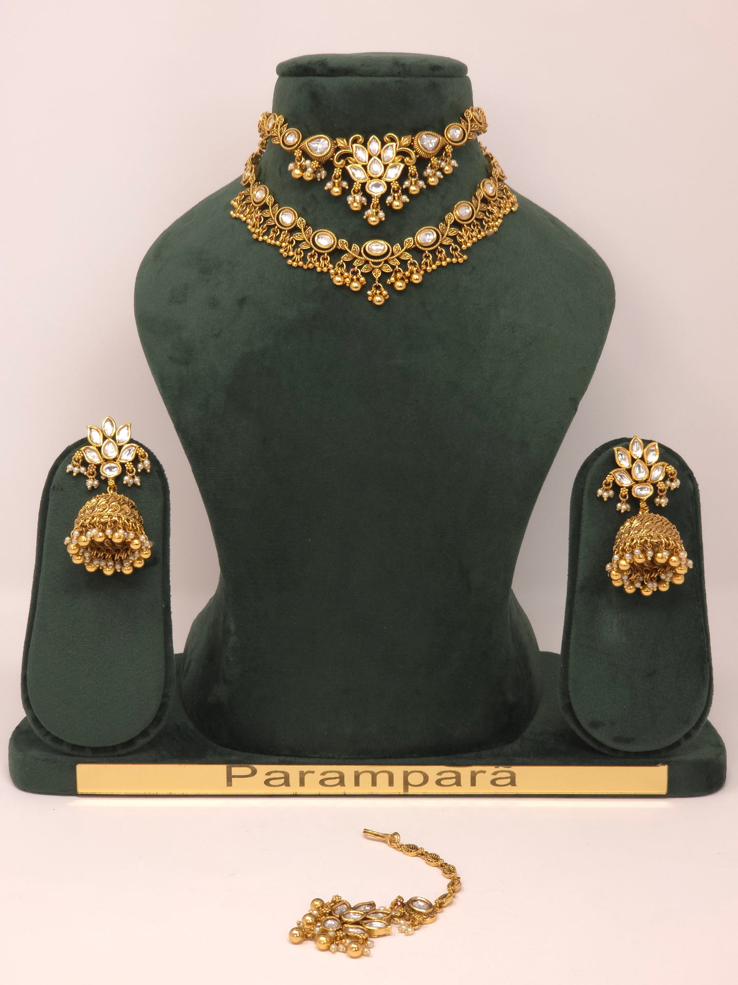 Gold Kundan Layered Necklace Set with Jhumka Earrings and Maang Tikka