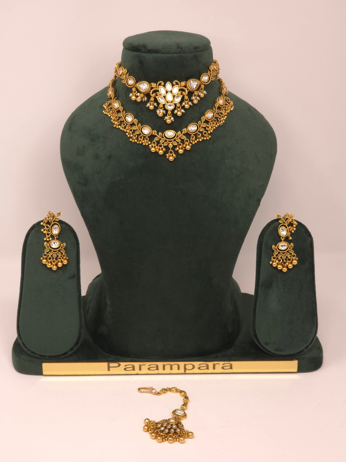 Gold Kundan Layered Necklace Set with Jhumka Earrings and Maang Tikka