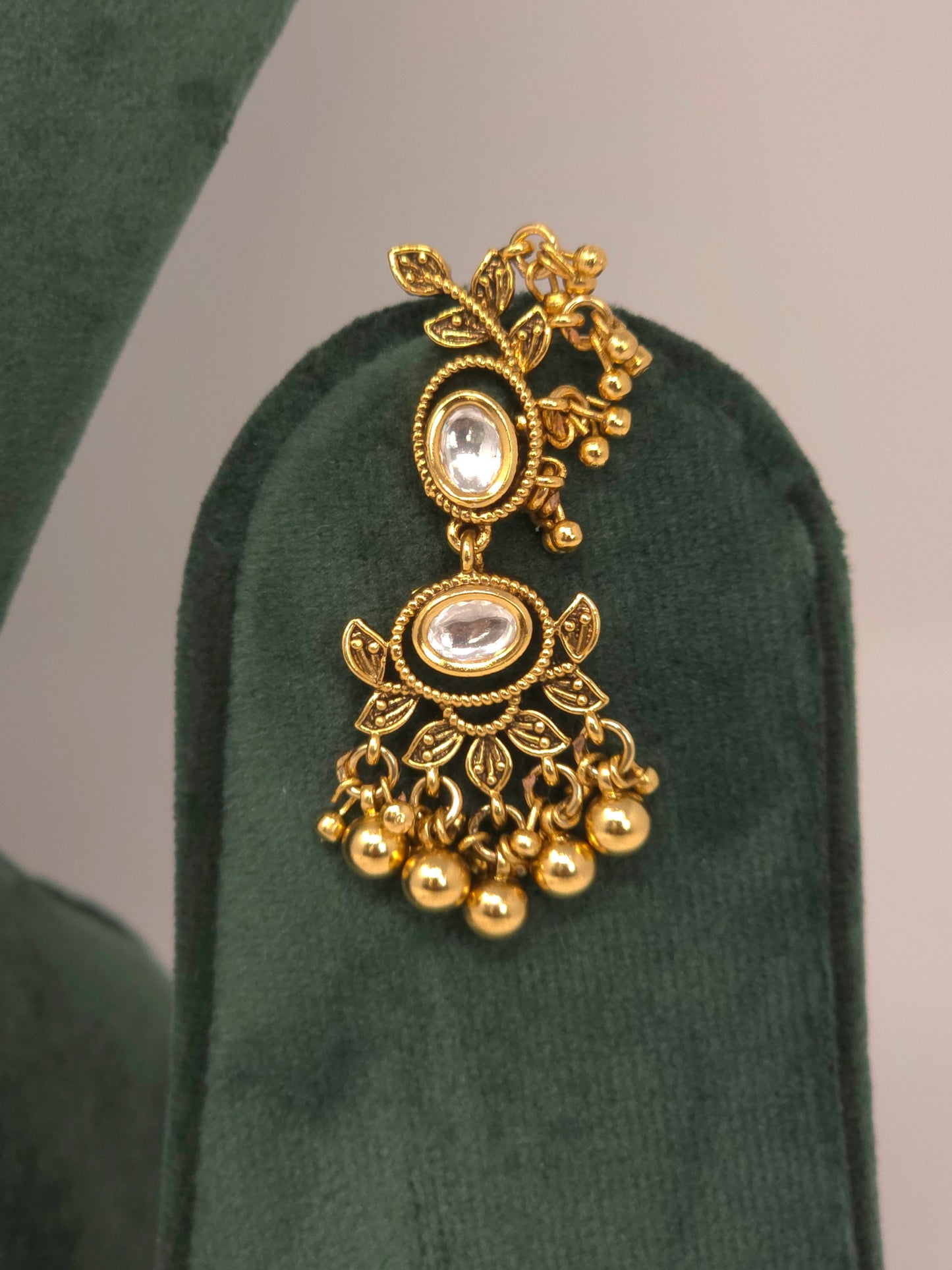 Gold Kundan Layered Necklace Set with Jhumka Earrings and Maang Tikka