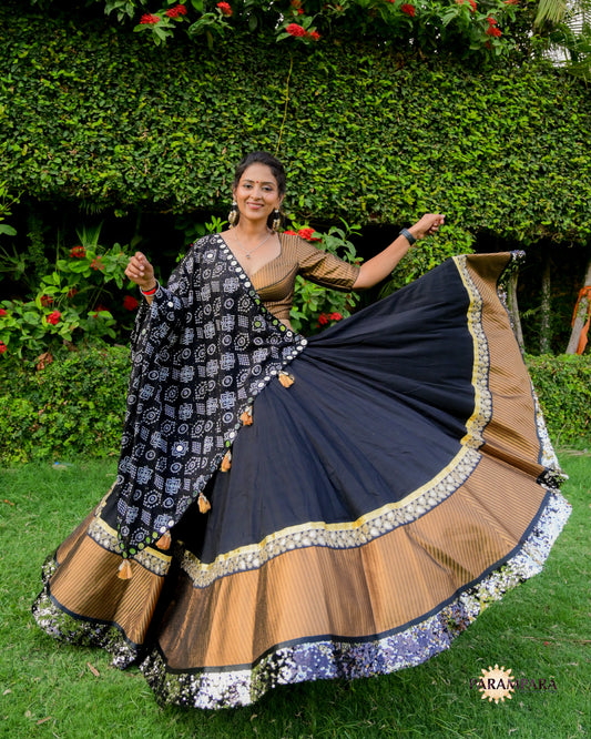 Black Chaniya Choli with Golden Border.