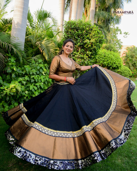 Black Chaniya Choli with Golden Border.