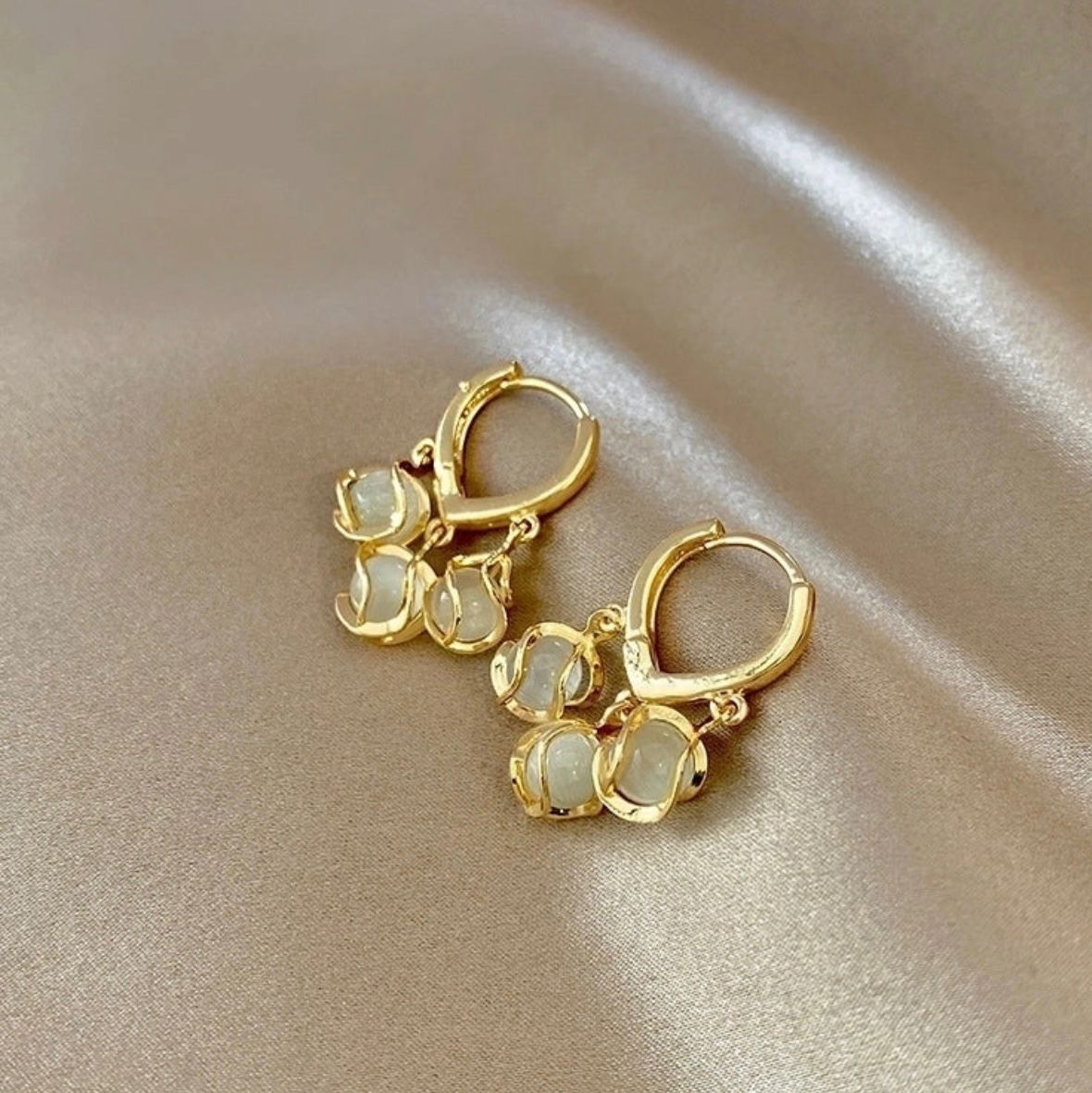 " Anti tarnish triple plated earrings with 3 mother of pearl dangle design "