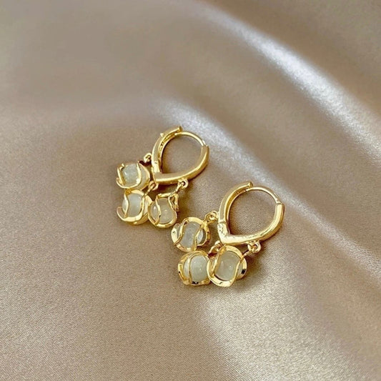 " Anti tarnish triple plated earrings with 3 mother of pearl dangle design "
