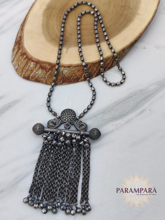 "Long oxidized tribal necklace with carved pendant and hanging chain tassels – handmade ethnic jewelry"