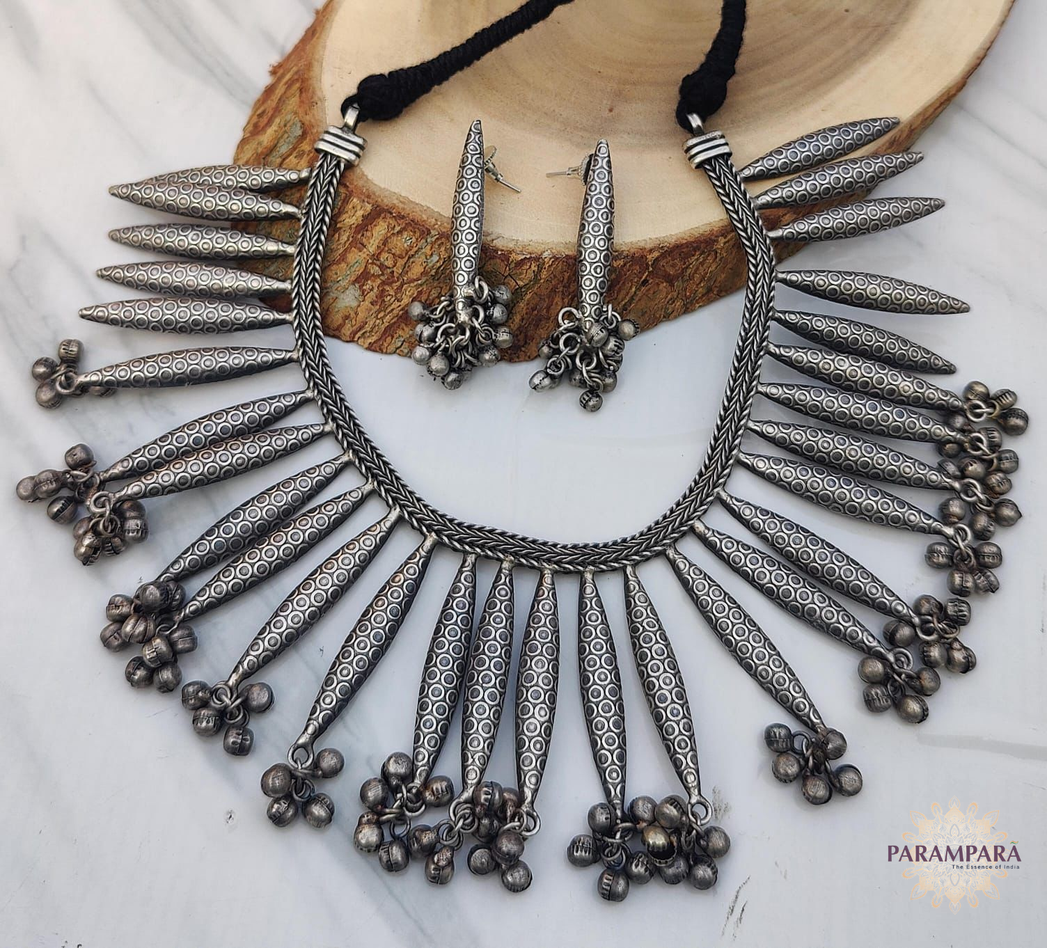 "Tribal-style oxidized spike necklace with matching earrings and ghungroo danglers – handcrafted Indian jewelry set "
