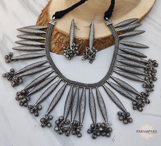 "Tribal-style oxidized spike necklace with matching earrings and ghungroo danglers – handcrafted Indian jewelry set "