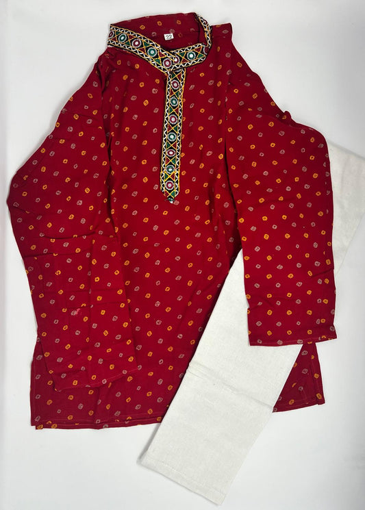 The kurta is made from a Maroon woven fabric with simple Colorful embroidery patterns.

The pajama is crafted from plain cotton.

Such attire is often worn for festivals, cultural events, or casual occasions.